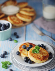 Cottage cheese pancakes - traditional Russian syrniki	