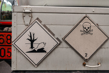 Hazardous, Poisonous and Corrosive liquids Signs Icons on Special Trucks exterior
