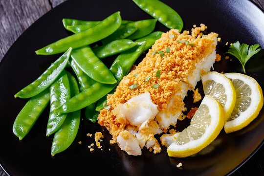 Baked Cod with Crackers toppings and snow peas