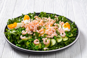 pink cocktail shrimps salad with veggies and eggs