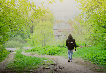 A closeup of a landscape with an unrecognizable person on a beautiful spring day
