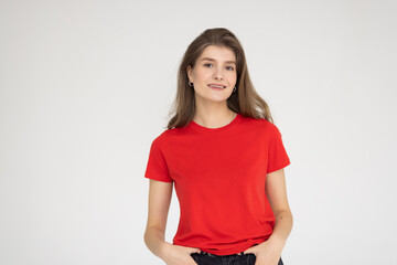 Obraz premium Smiling young woman isolated over white background