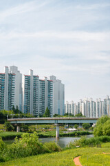 Fototapeta na wymiar Jungnangcheon Stream park and apartment buildings in Seoul, Korea
