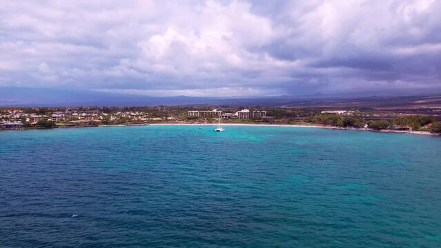 Aerial Timelapse Over Blue Ocean Towards Beachside Resort In Hawaii, Drone