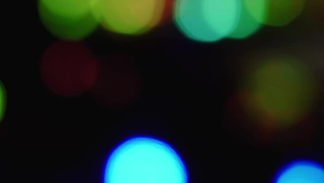Blurred background of light spots. Abstract blurred image of Colorful bokeh light at night background.

