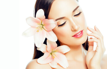 young attractive lady close up with hands on face isolated flower lily brunette spa nude makeup, beauty concept