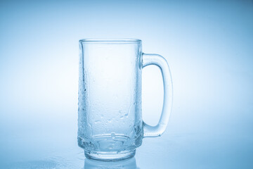 Empty beer mug with water droplets  isolated on white background
