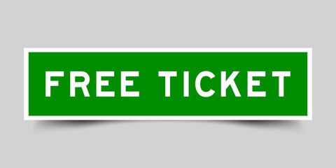 Sticker label with word free ticket in green color on gray background
