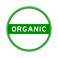 Green color round seal sticker in word organic on white background