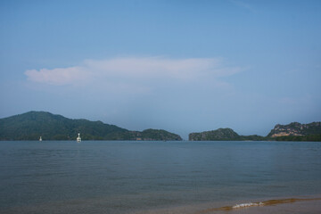 View landscape limestone mountain island in sea ocean of Mu Ko Phetra Marine National Park for thai people traveler travel visit and tour in Pak Bara waterfront beach at La ngu city in Satun, Thailand