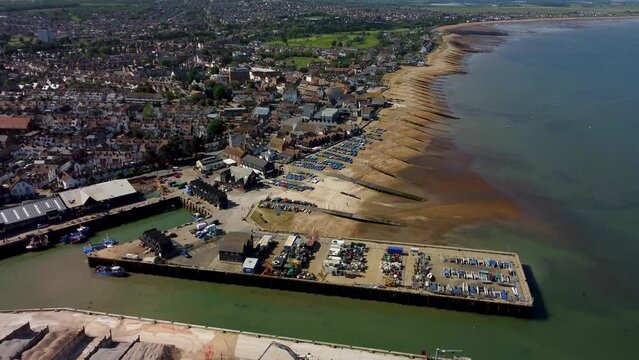 An aerial dolly forward over Whitstable town and Harbour.