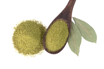 Bay leaf powder in a wooden spoon isolated on white background. Dry bay leaf. Bay leaf spice.