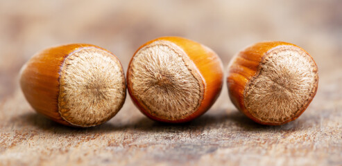 Hazelnut group on a wooden table, healthy eating banner