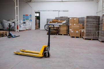hand pallet truck, in the warehouse part of the factory. Selective Focus pallet truck