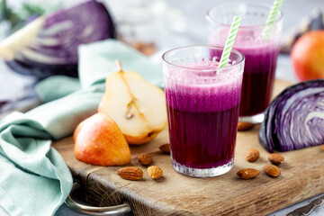 Healthy vegetable smoothie made of red cabbage and red barlett