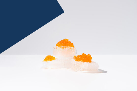 Orange tobiko caviar placed on ice