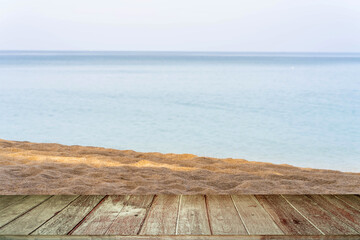 Fototapeta premium Old wood texture Table Against Sand Beach Background.