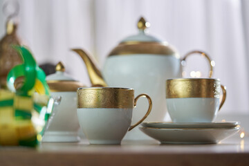 tea set and  cookies on wooden table , ramadan celebration with ketupat and lantern