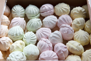 Obraz na płótnie Canvas Fresh sweet air marshmallow lies in cardboard packaging prepared for sale in stores