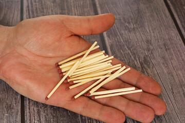 matchsticks in a man's hand
