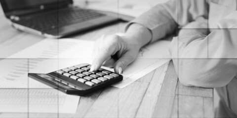 Hands of an accountant working on financial documents, geometric pattern