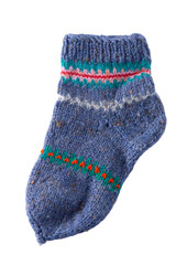 Knitting socks from woolen threads. Handmade cozy homemade warm winter colorful striped knitted socks.