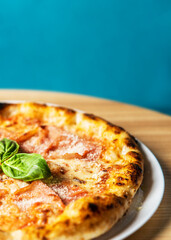 Hot tasty traditional italian pizza with ham.
