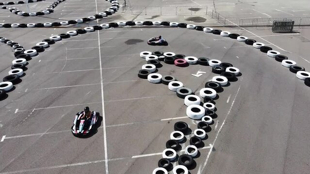 Karting on a karting track, drone view of the racer during the race