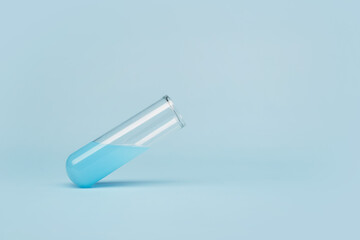 Medicine clinical science laboratory chemical test tube filled with blue liquid floating in air above the surface at an angle of 45 degrees isolated on the bright blue solid fond background