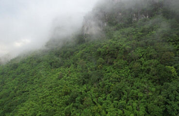 high nature mountain view from drone with foggy cloud in rainy season