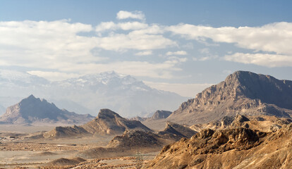 Wrinkled desert landscape around the Zoroastrian burial site Towers of Silence in Yazd, central Iran, Persia.
