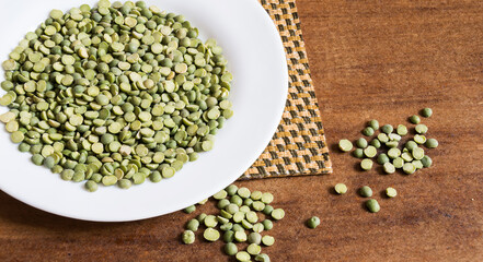 White plate with split pea seeds