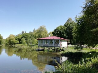 Obraz premium house on the river, cafe on the river, romantic place, a place for lovers, beautiful places