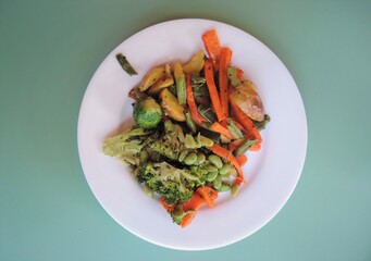 Cooked vegetables - carrots, brussels sprouts, potatoes, broccoli.