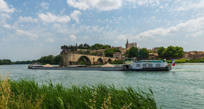 Panorama of Avignon with the Saint Benezet bridge and a barge on the Rhone, in Vaucluse, in Provence, France