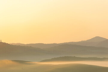 Sunrise with fog over a valley in Tuscany - Italy IX