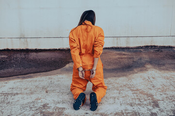 Prisoner in orange robe concept,Portrait of asian woman in Prison uniforms on white background,
