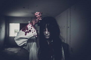 Portrait of asian woman make up ghost,Scary horror scene for background,Halloween festival concept,Ghost movies poster,angry spirit in the apartment