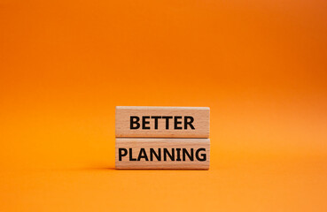 Better planning symbol. Concept word Better planning on wooden blocks. Beautiful orange background. Business and Better planning concept. Copy space