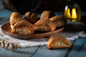 Homemade cookies with cottage cheese in a wooden plate on a rustic table