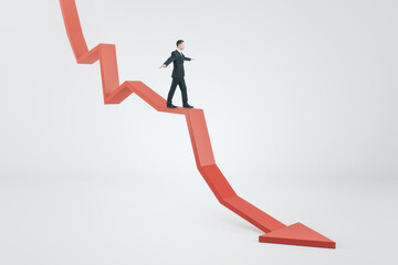 Crisis management concept with businessman keeping balance trying to stay afloat on red arrow down...
