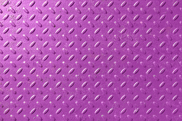 Corrugated sheet of iron with lentil-shaped protrusions. The surface is covered with purple paint. Pattern. Background. Texture.