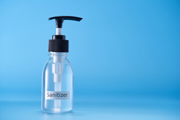 hand sanitizer against blue background