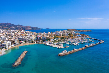 Naklejka premium Agios Nikolaos, a picturesque coastal town with colorful buildings around the port in the eastern part of the island Crete, Greece