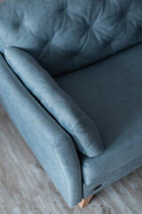 Fototapeta na wymiar Comfortable vintage sofa stands on a wooden floor.