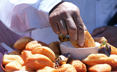 Festive Asian dish baursaki. Fried dough balls.Blur. Fatty food/ selective focus