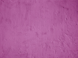 Grunge purple plaster wall with stains.
