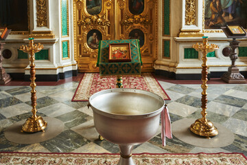 baptismal bowl in the Orthodox Church before baptism and in front of the altar