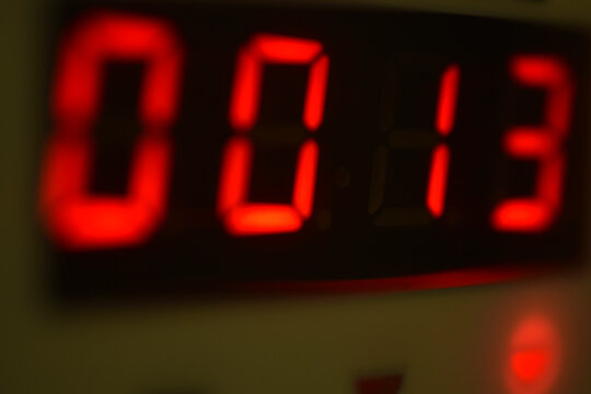 The number 13 on the electronic clock display