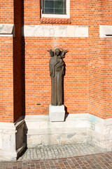 Naklejka premium KRAKOW, POLAND - MAY 10, 2022: A statue by St. Joseph Church a historic Roman Catholic church in Podgorze district of Krakow, Poland.